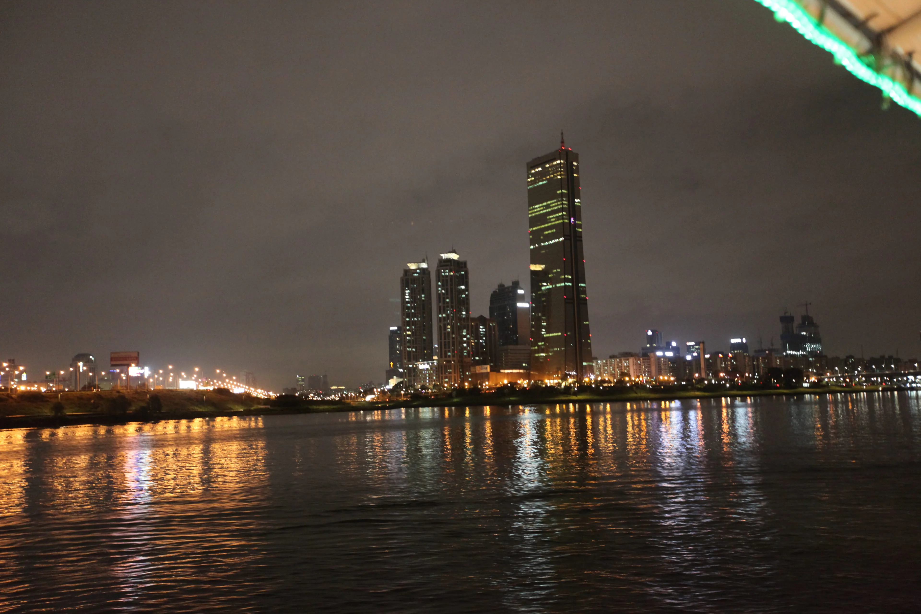 Seoul at night, lit towers above the river